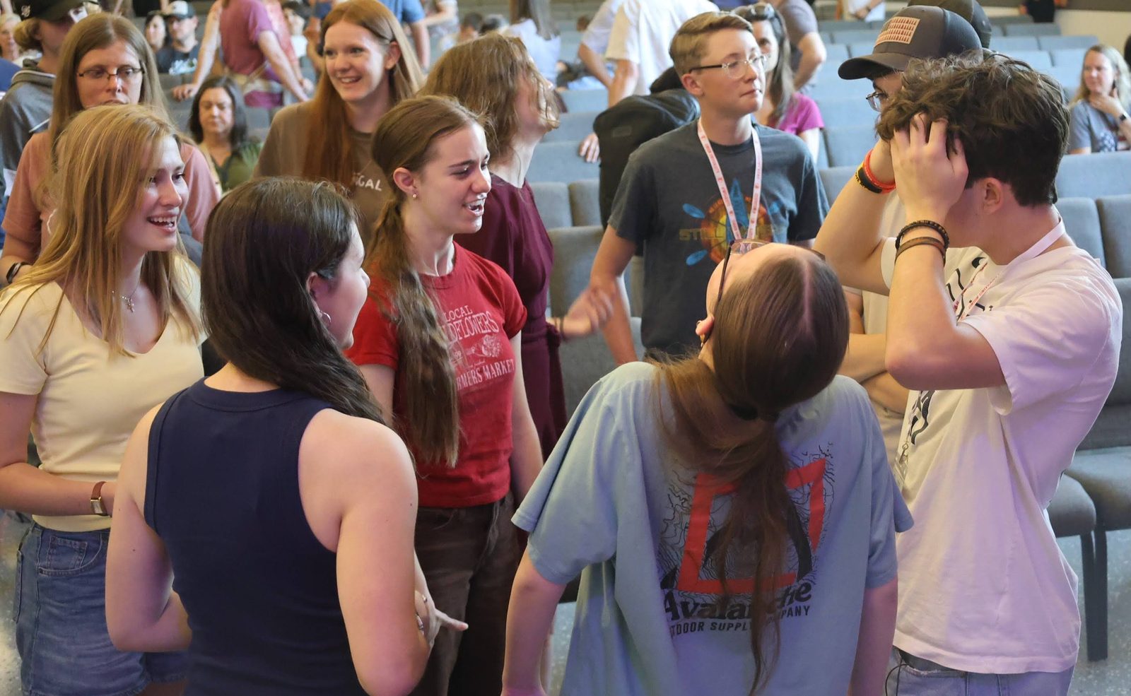 Students talking and laughing together at a social